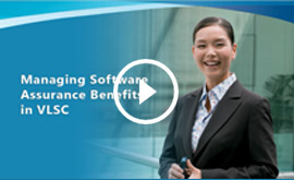 managing Software Assurance video Play button on top of picture of smiling woman in gray suit holding cellphone